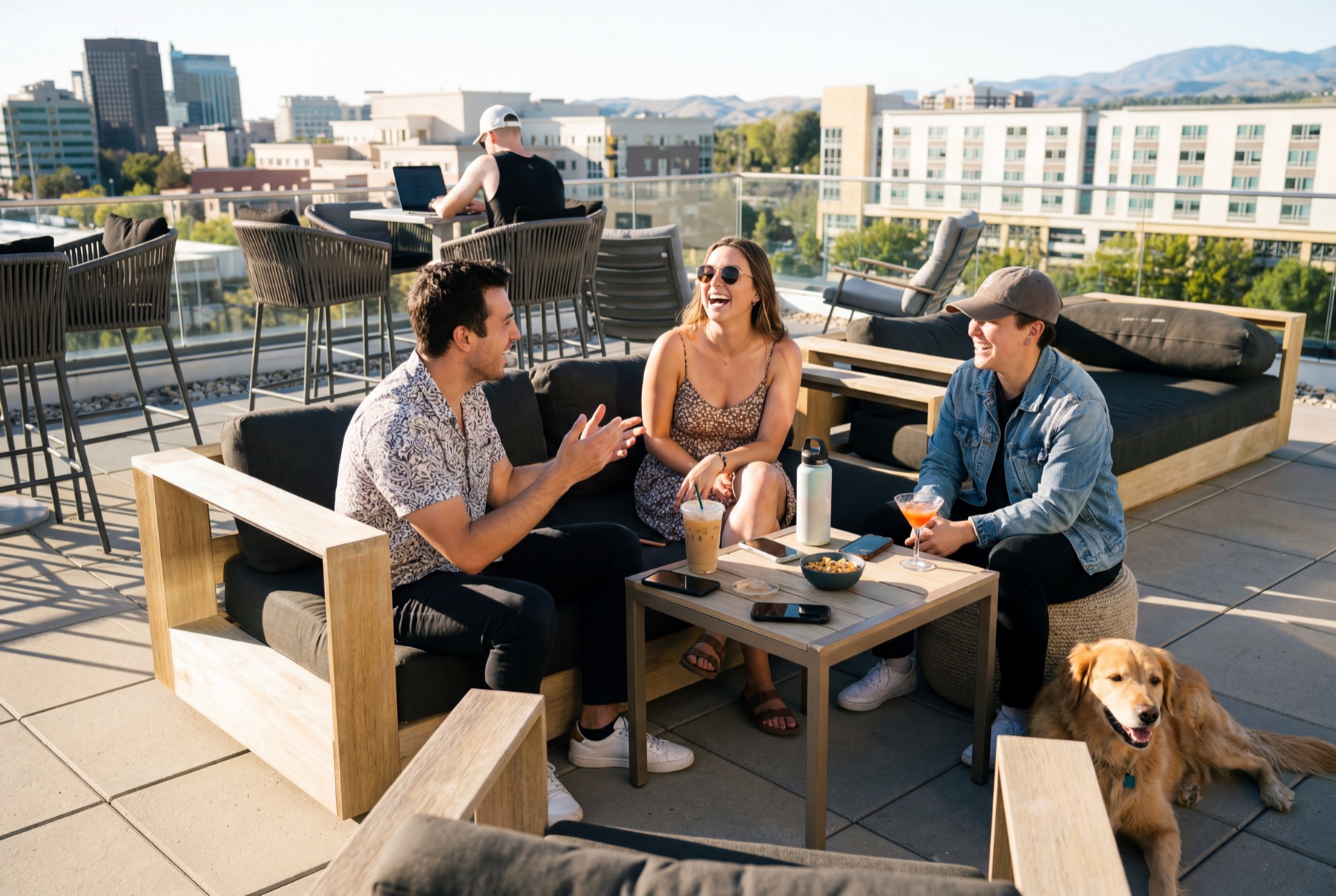 Residents socializing on a rooftop amenity deck